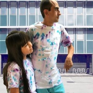 Father and daughter, tie-dye shirt.
